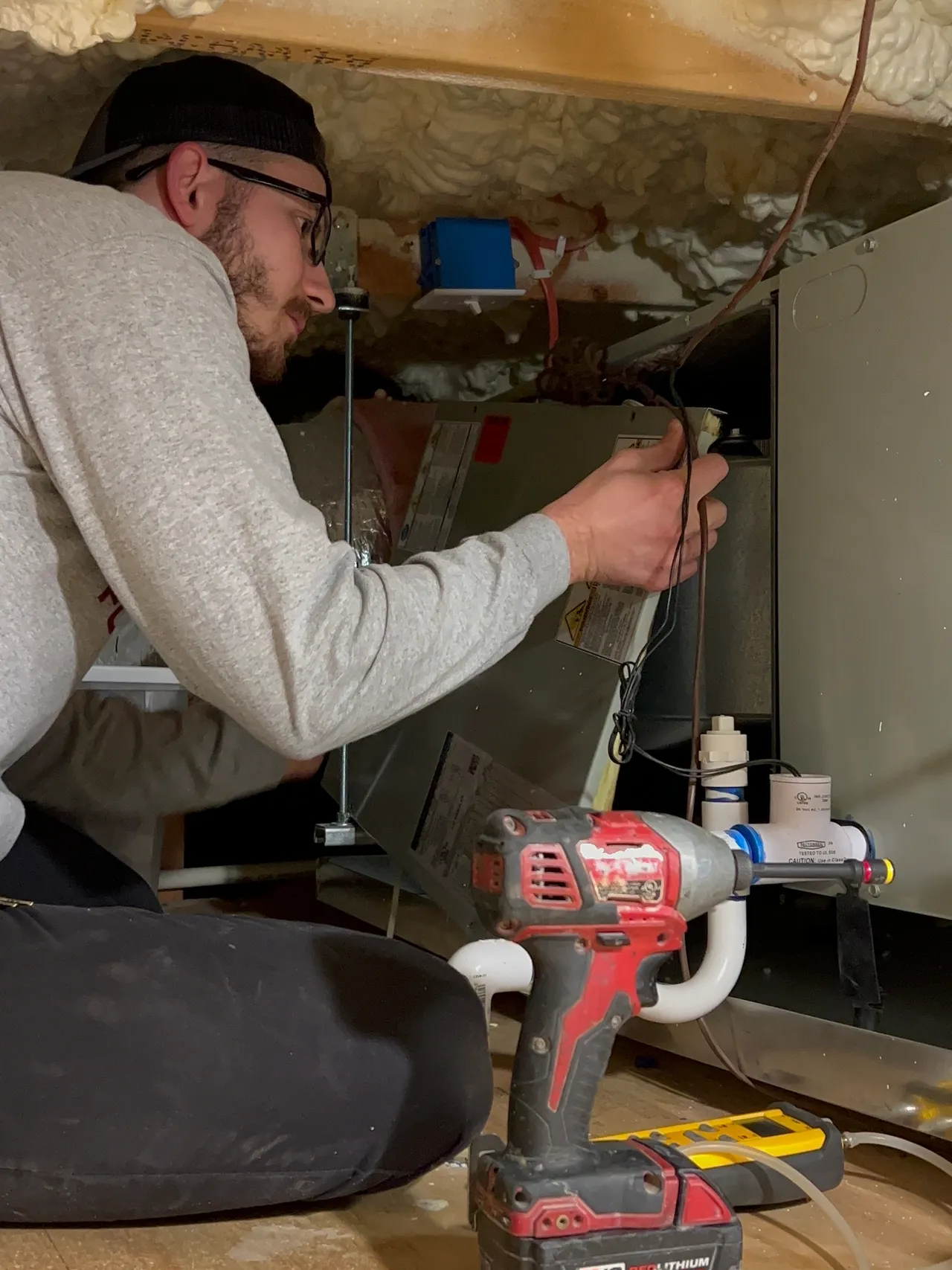Fortis Air technician installing a residential air conditioning system